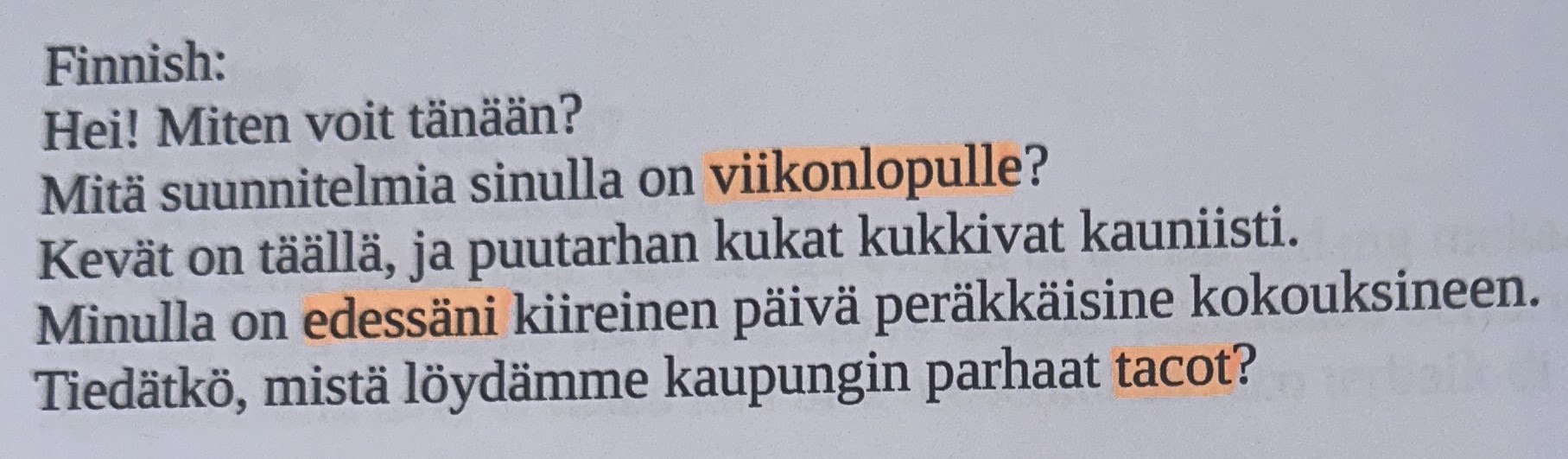 A bookpage in Finnish language with some highlighted words.