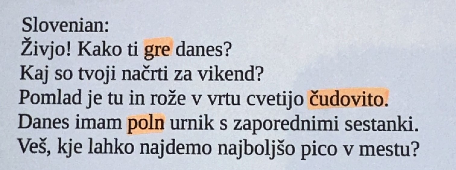 A bookpage in Slovenian language with some highlighted words.